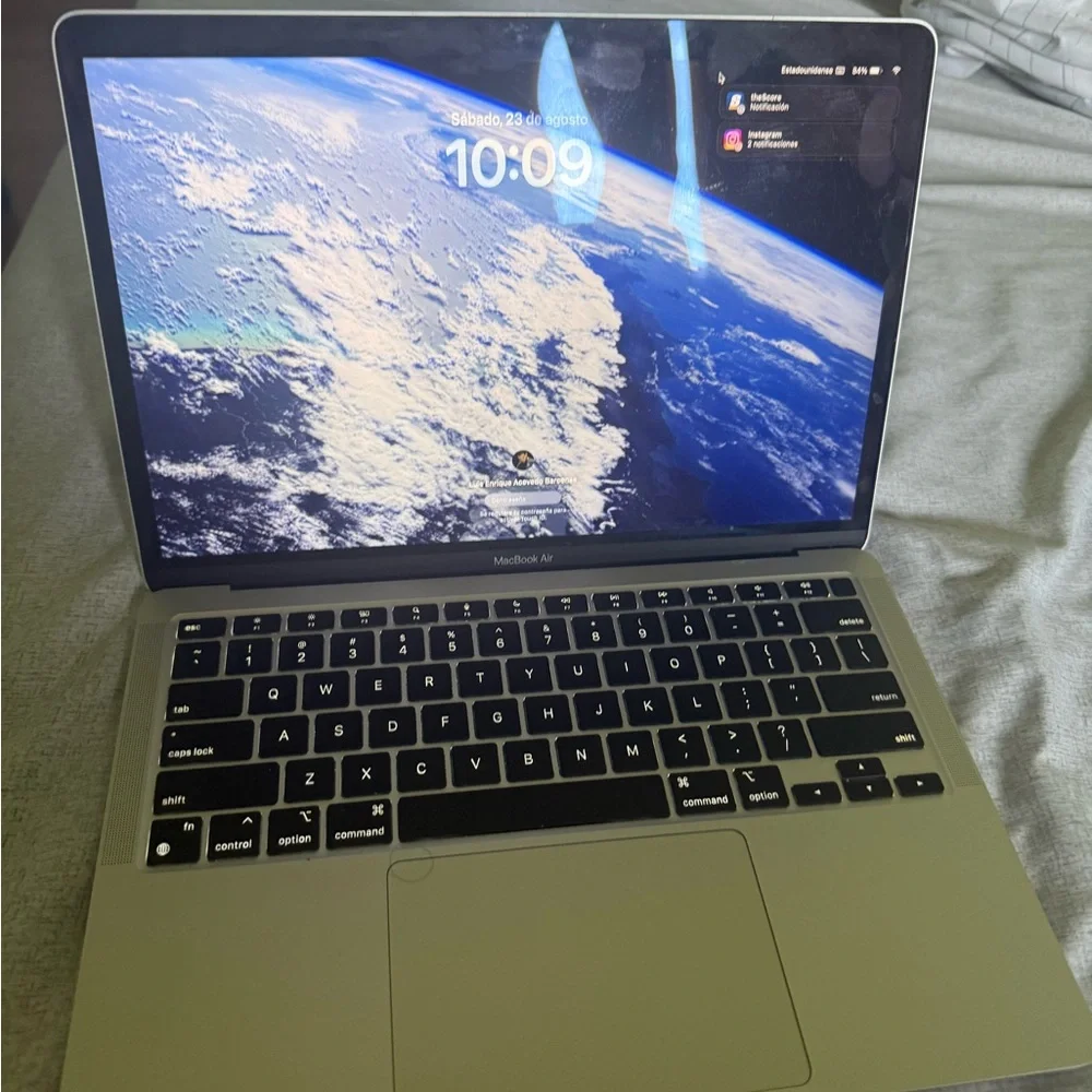 Apple Laptop with Red Logo and Silver Body